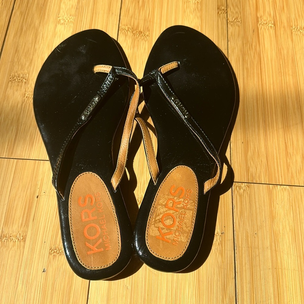 Michael Kors flip flops size 9.